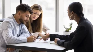 Buyer signing a sale and purchase agreement for a property purchase