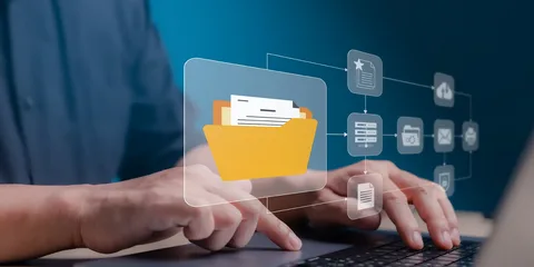 Real estate agent organizing digital documents using document management software