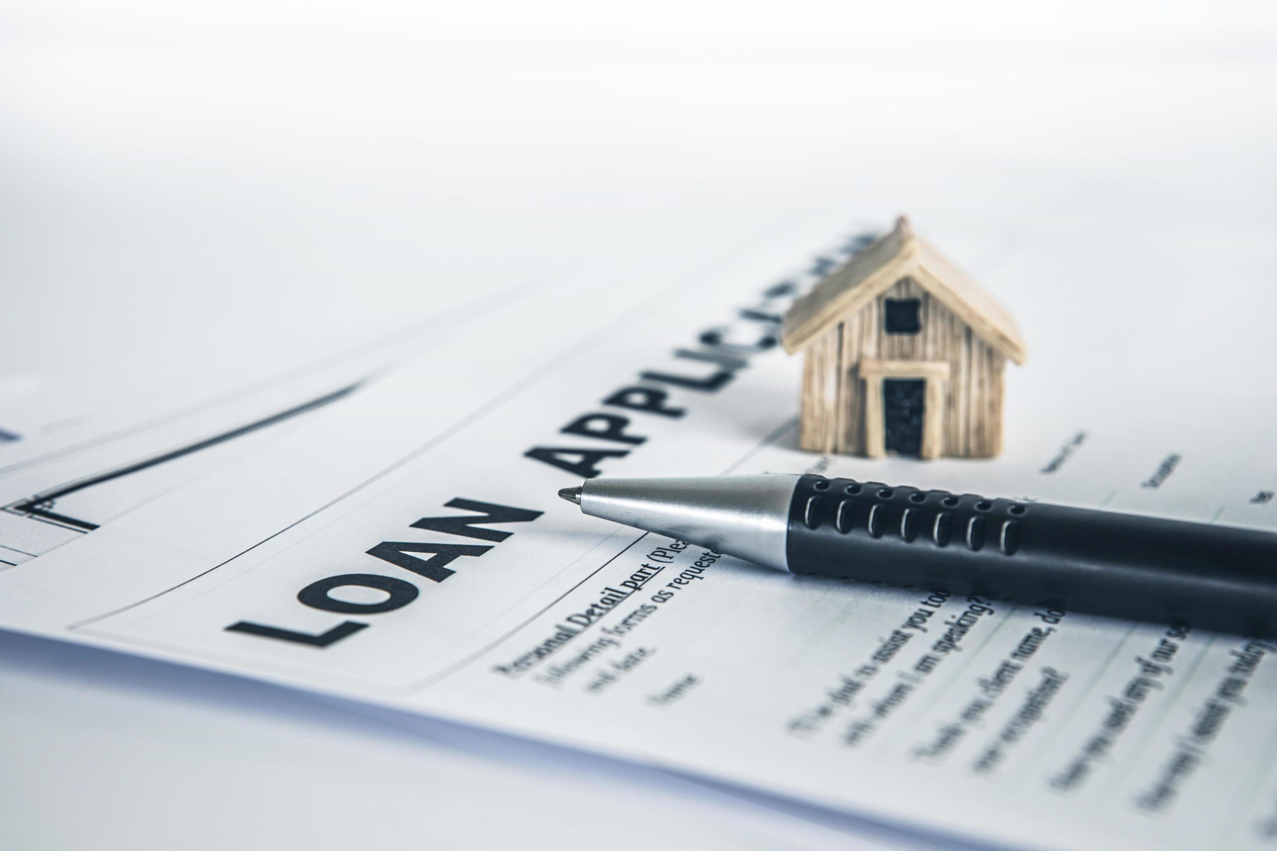 Person signing a home mortgage loan application form