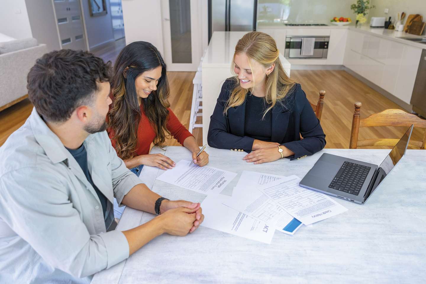 Couple reviewing home mortgage loan documents and repayment terms