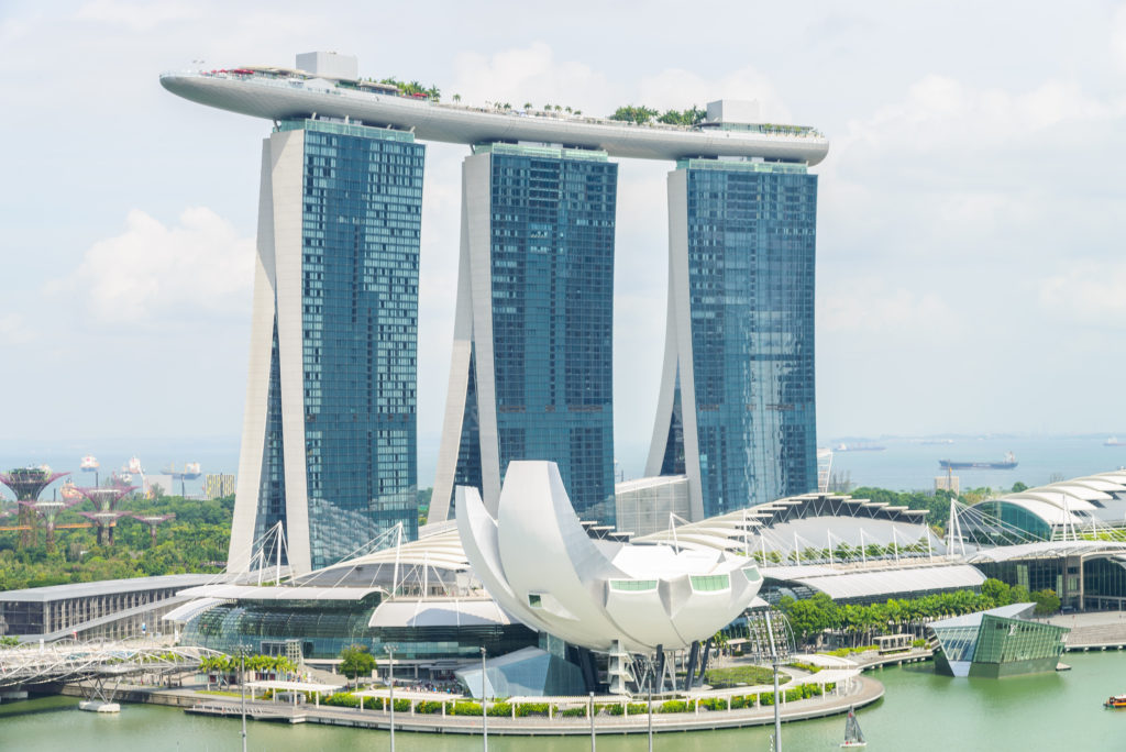 Singapore Marina Bay Sands skyline with CEA registered property agent analyzing real estate market