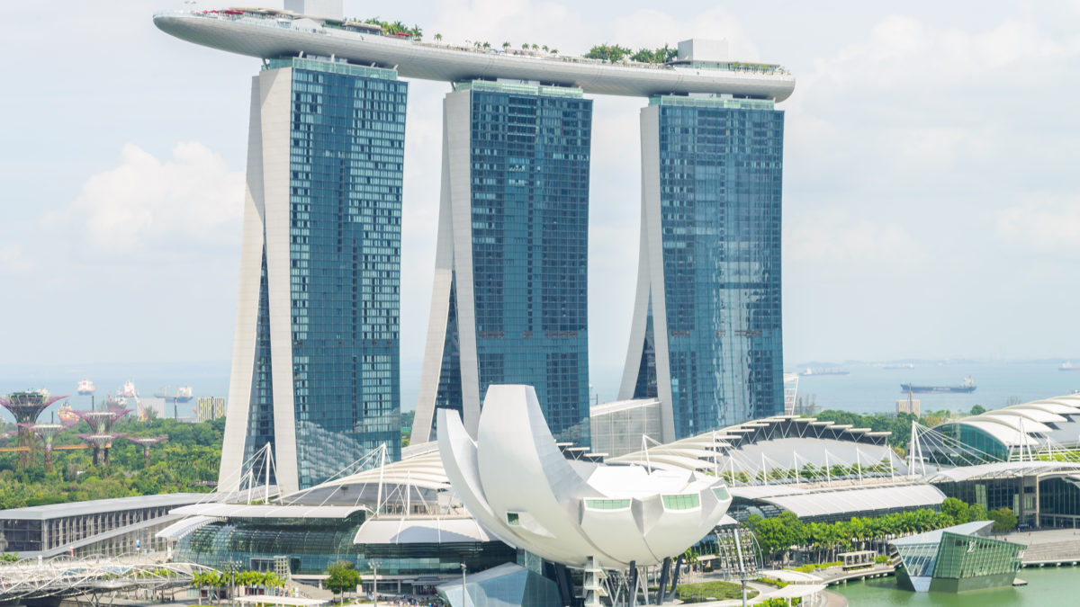 Singapore Marina Bay Sands skyline with CEA registered property agent analyzing real estate market