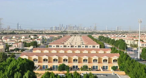 Jumeirah Village Circle mid-rise apartment buildings and community park