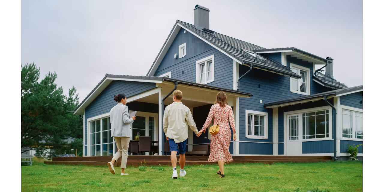 Malaysia property agent and homeowner discussing a signed listing agreement