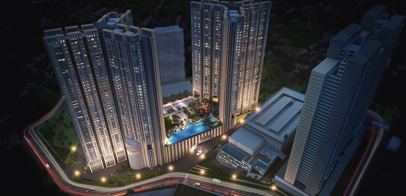 Real estate negotiator showing a Malaysian condominium to a young couple during a property viewing
