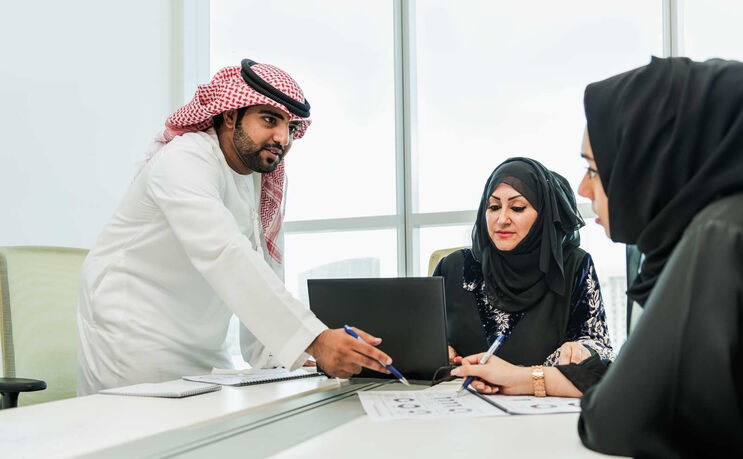 Licensed property agent showing a client a listing in the UAE