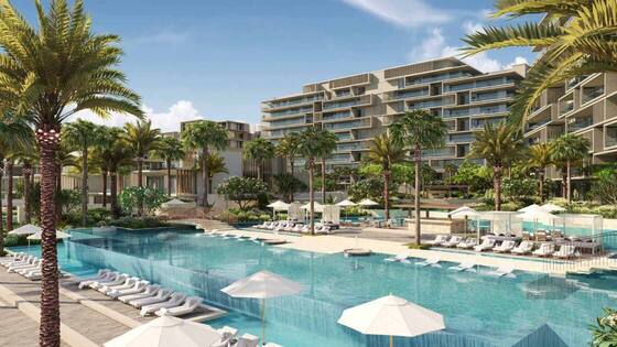 Apartments for Sale in Palm Jumeirah Beachfront apartment building with pool and palm trees on Palm Jumeirah, Dubai