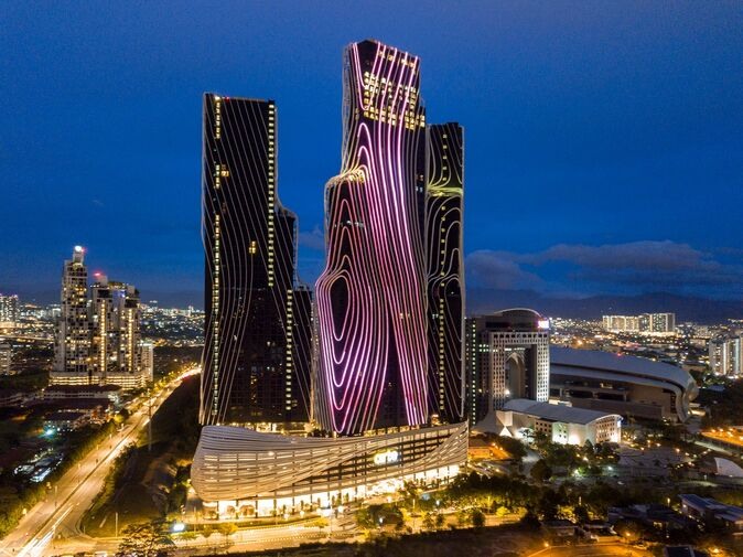 Mont Kiara for International Families Modern high-rise residential towers lit up at night in Kuala Lumpur