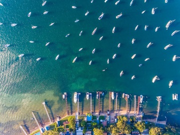 Prime Waterfront and City-Center Apartments in Dubai Aerial view of boats moored along a Dubai waterfront